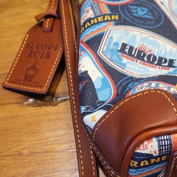 Dooney & Bourke Blue and Red Shoulder Bag with Travel-Inspired Design - Picture 2 of 6